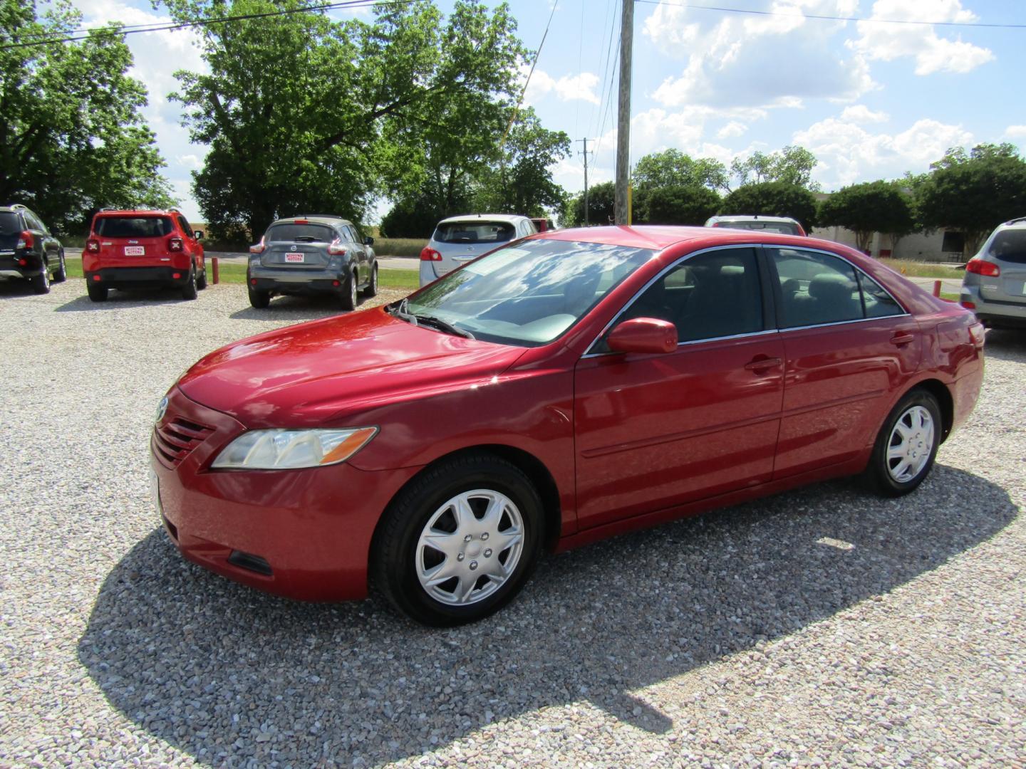 2007 Red /Tan Toyota Camry (4T1BK46K97U) with an 4 CYL engine, Automatic transmission, located at 15016 S Hwy 231, Midland City, AL, 36350, (334) 983-3001, 31.306210, -85.495277 - Photo#2